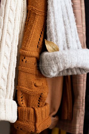 Photo for Closeup of warm sweaters and pullovers. Autumn fashion concept. - Royalty Free Image