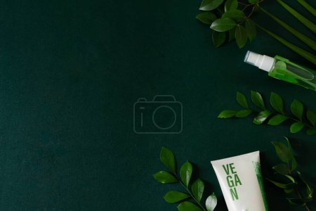 Photo for Vegan cosmetic cream with beauty supplies isolated on deep green background. Skin care concept. - Royalty Free Image