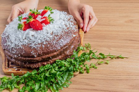 Photo for Chocolate, coconut and strawberry cake on background. - Royalty Free Image