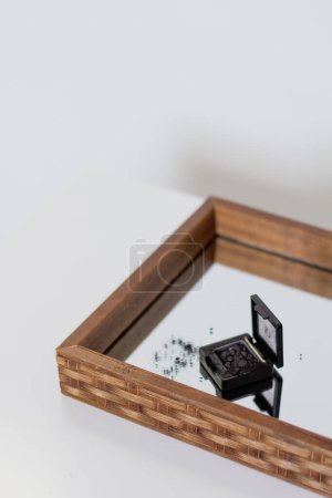 Photo for Beautiful black eye shadow palette on mirror tray - Royalty Free Image
