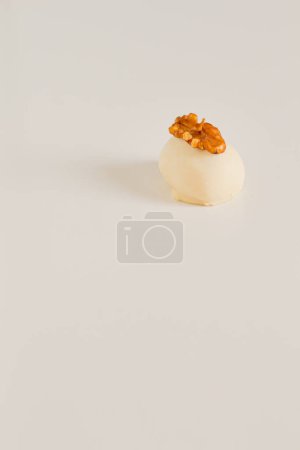 Photo for White chocolate candy with walnut kernel isolated on white background - Royalty Free Image