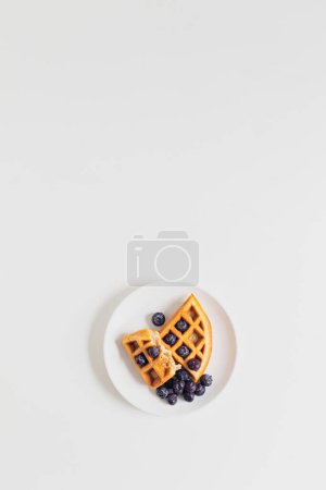 Photo for Breakfast table. Waffle and blueberry. Flat lay. - Royalty Free Image