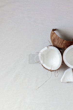 Photo for Recently broken coconut on a white background. - Royalty Free Image