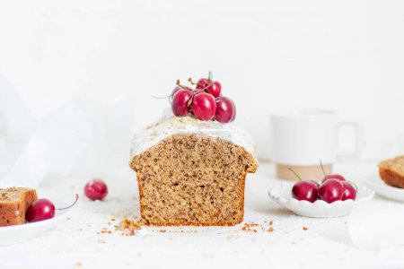 Photo for Homemade nut cake with cherrys on white background. Aesthetic breakfast concept. - Royalty Free Image