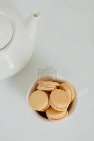 Photo for Beige biscuits on white background. Minimalist composition. - Royalty Free Image