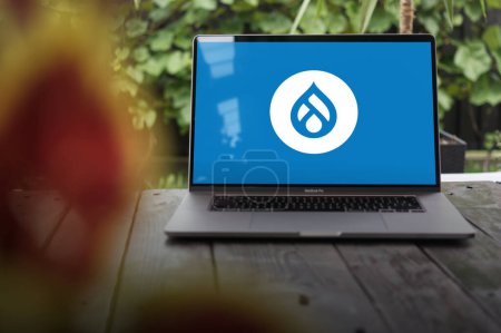 Photo for WROCLAW, POLAND - SEPTEMBER 14, 2023:Drupal logo, a free and open-source web content management system (CMS) written in PHP, displayed on a MacBook Pro screen - Royalty Free Image
