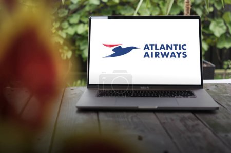 Photo for WROCLAW, POLAND - NOVEMBER 29, 2023:Atlantic Airways logo, national airline of the Faroe Islands, displayed on MacBook Pro screen - Royalty Free Image