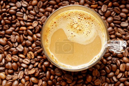 Photo for A cup of hot coffee on coffee beans background. - Royalty Free Image