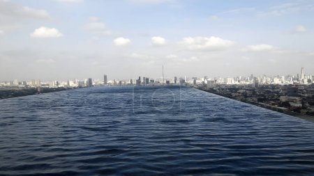 Photo for View of Bangkok Thailand's high building from a rooftop swimming pool - Royalty Free Image