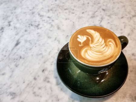 Sideway shop coffee, Swan latte art coffee on the table.