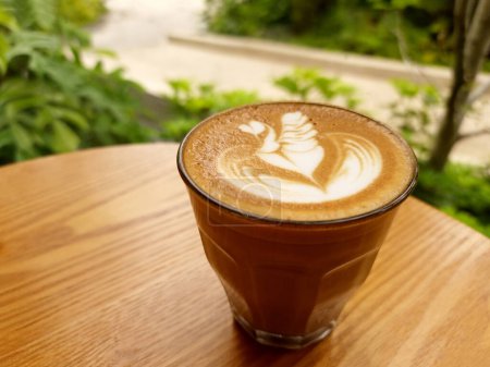 Sideway shop coffee, Swan latte art coffee on a wooden table.