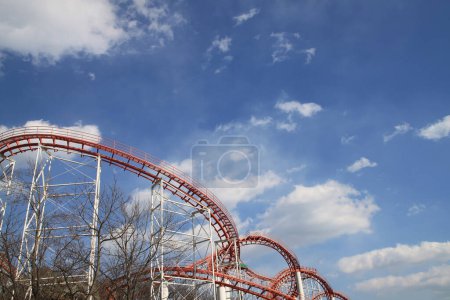 a view of an amusement park with a blue sky