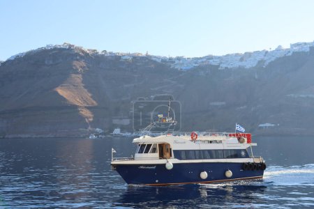 Photo for Caldera Serenity: Sailing by Fira, Santorini - Royalty Free Image