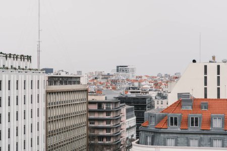 Photo for Lisbon; Aerial view of the city on an overcast day with all these buildings from the late architectural style, all in shades of grey matching the skies giving a very sad vibe to the city - Royalty Free Image
