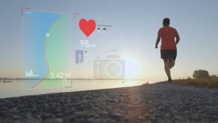 Photo for Health Diagrams and Heart Rate Infographics on Male Running by River. Graphics - Royalty Free Image