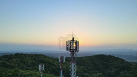 Photo for Aerial view of a Engineer doing maintenance on Radio towers in the mountains - Royalty Free Image