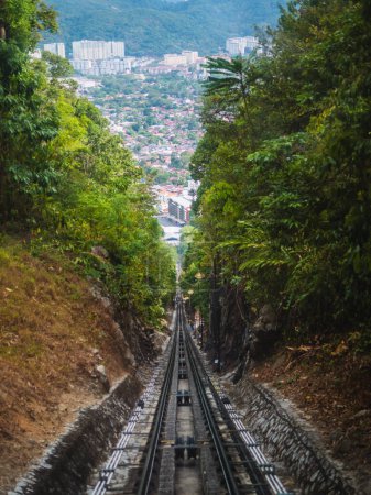 Cable car or tram uphill in Penang Malaysia. The Penang Hill Railroad track. View of the funicular railway going up Penang Hill.