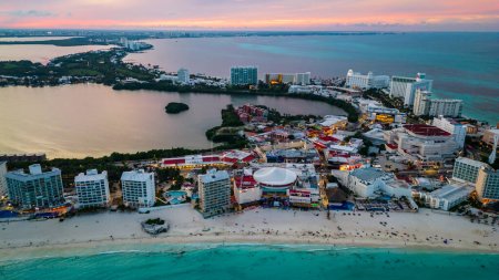 Aerial View Over the Cancun Coastline Beachfront with Hotels and Resorts. Tourist Destination for Vacation and Holidays in Mexico's Famous Landmarks. Scenic Views Overlooking Tropical Paradise.