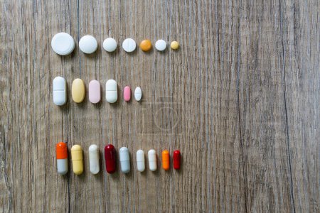 Photo for Rows of different types and formats of medicines, capsules, pills, tablets. of many colors and shapes - Royalty Free Image