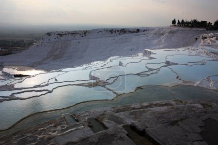 Photo for Pamukkale at sunset-Sinter terraces Trkiye, near the ancient Greco-Roman city of Hierapolis - Royalty Free Image