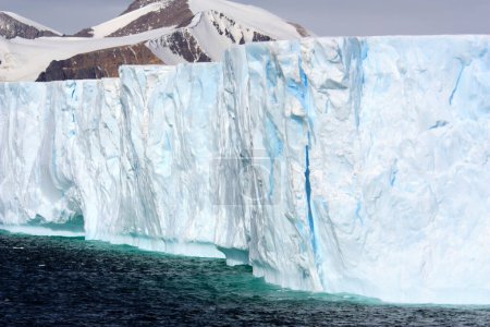 Photo for Tabular iceberg in Marguerite Bay a long bay on the southwest coast of the Antarctic Peninsula, Antarctica - Royalty Free Image