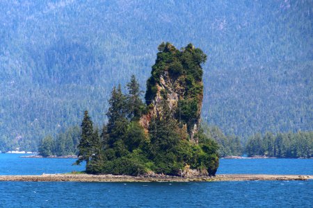 Sea voyage past New Eddystone Rock, a volcanic tower in Misty Fjords National Monument Park near Ketchikan Inside Passage, Alaska, USA