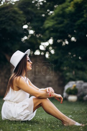 Photo for Portrait of beautiful woman in a summer hat - Royalty Free Image