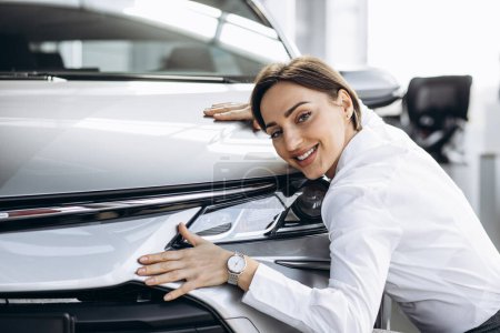 Photo for Beautiful woman hugging a car - Royalty Free Image