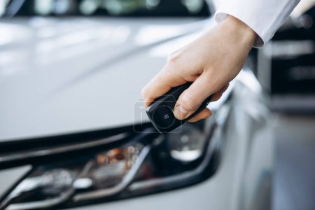 Photo for Woman holding car keys by her new car close up photo - Royalty Free Image