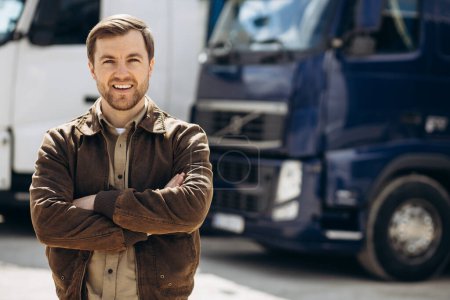 Photo for Truck driver standing by his lorry - Royalty Free Image
