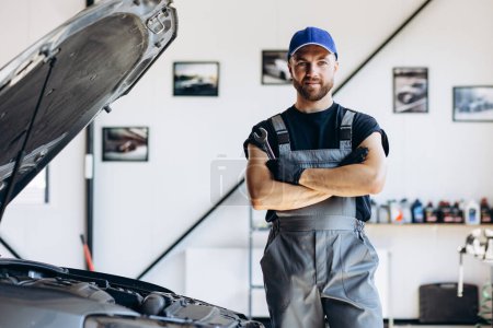 Photo for Car mechanic working on car service repair shop - Royalty Free Image