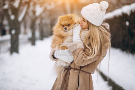 Photo for Woman with dog in winter - Royalty Free Image