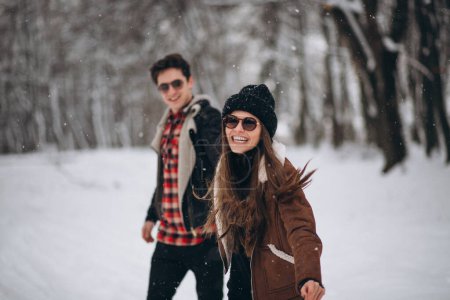 Photo for Couple on valentine's day in winter forest - Royalty Free Image