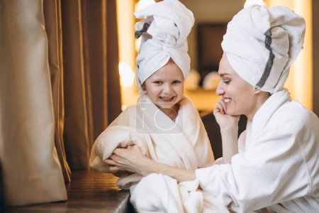 Photo for Mother and daughter in bathrobes - Royalty Free Image