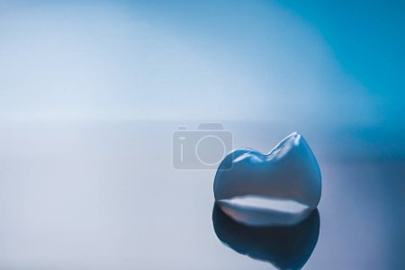 Photo for Shiny veneers isolated on blue background - Royalty Free Image