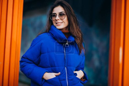 Photo for Young attractive woman in blue winter jacket - Royalty Free Image