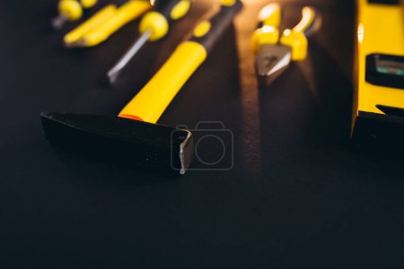 Photo for Yellow set of tools on black background - Royalty Free Image