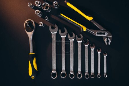 Photo for Yellow set of tools on black background - Royalty Free Image