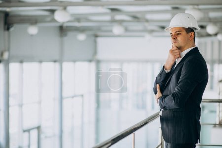 Photo for Handsome business man engineer in hard hat in a building - Royalty Free Image