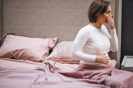 Photo for Young pregnant woman having toxicosis in first trimester - Royalty Free Image