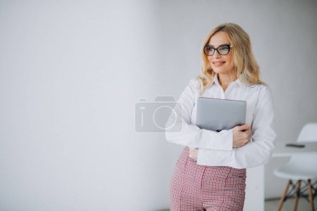 Photo for Beautiful middle aged business woman at the office - Royalty Free Image