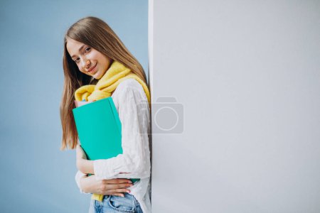 Photo for Girl student standing with colorful folders - Royalty Free Image