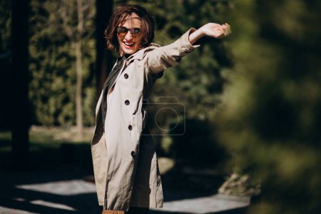 Photo for Young business woman in a trendy coat outside - Royalty Free Image