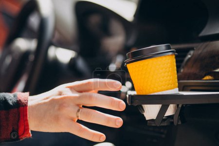Photo for Cup of coffee in a car cup holder - Royalty Free Image