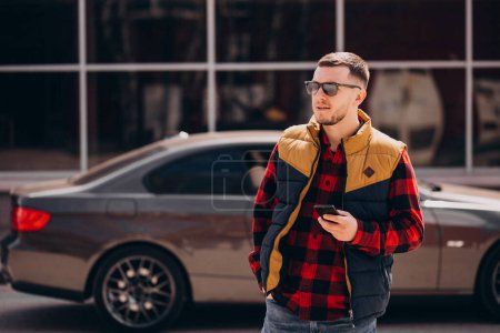 Photo for Handsome man standing by the car - Royalty Free Image