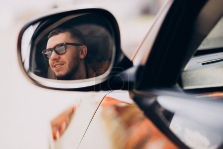 Photo for Portrait of handsome man sitting in car - Royalty Free Image