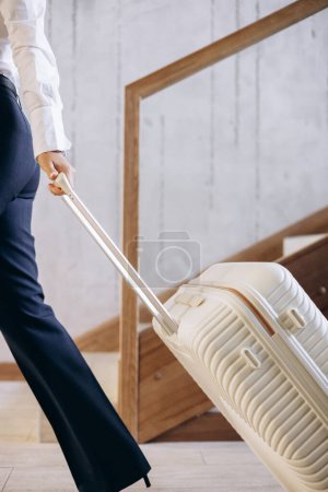 Photo for Business woman with travel luggage at the hotel - Royalty Free Image