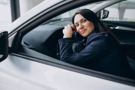 Photo for Business woman sitting in her new car - Royalty Free Image