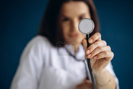 Photo for Young woman doctor in lab coat with stethoscope - Royalty Free Image