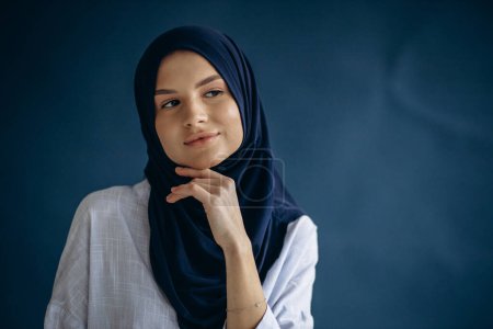 Photo for Young muslim woman wearing headscarf - Royalty Free Image